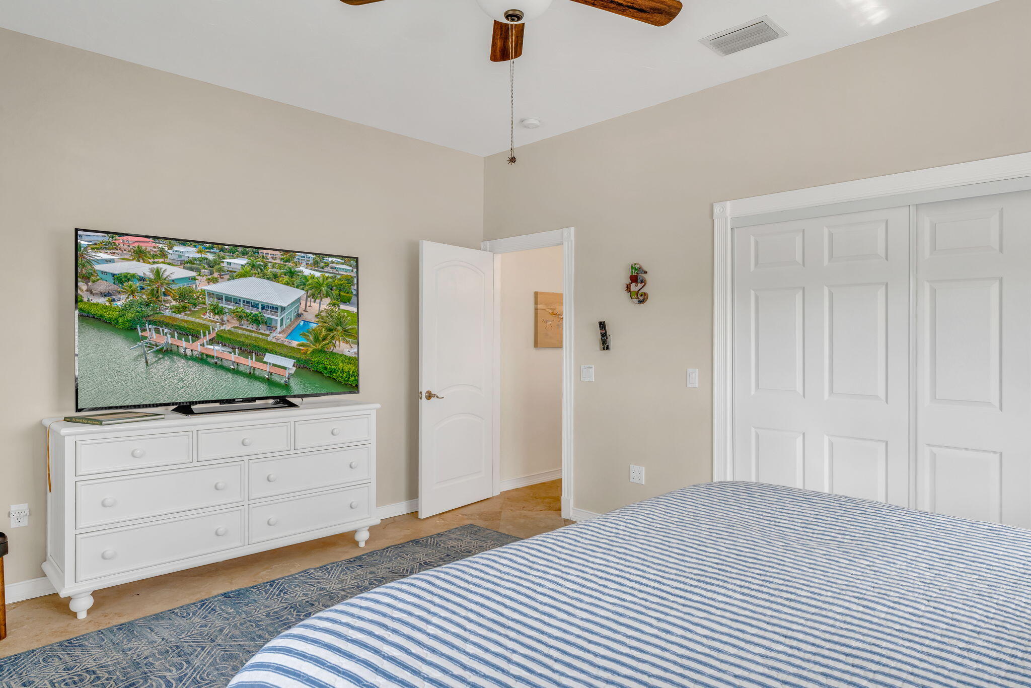 151 Ave G Marathon, FL 33050 - Photo 16 of 56 a bedroom with furniture and a flat screen tv