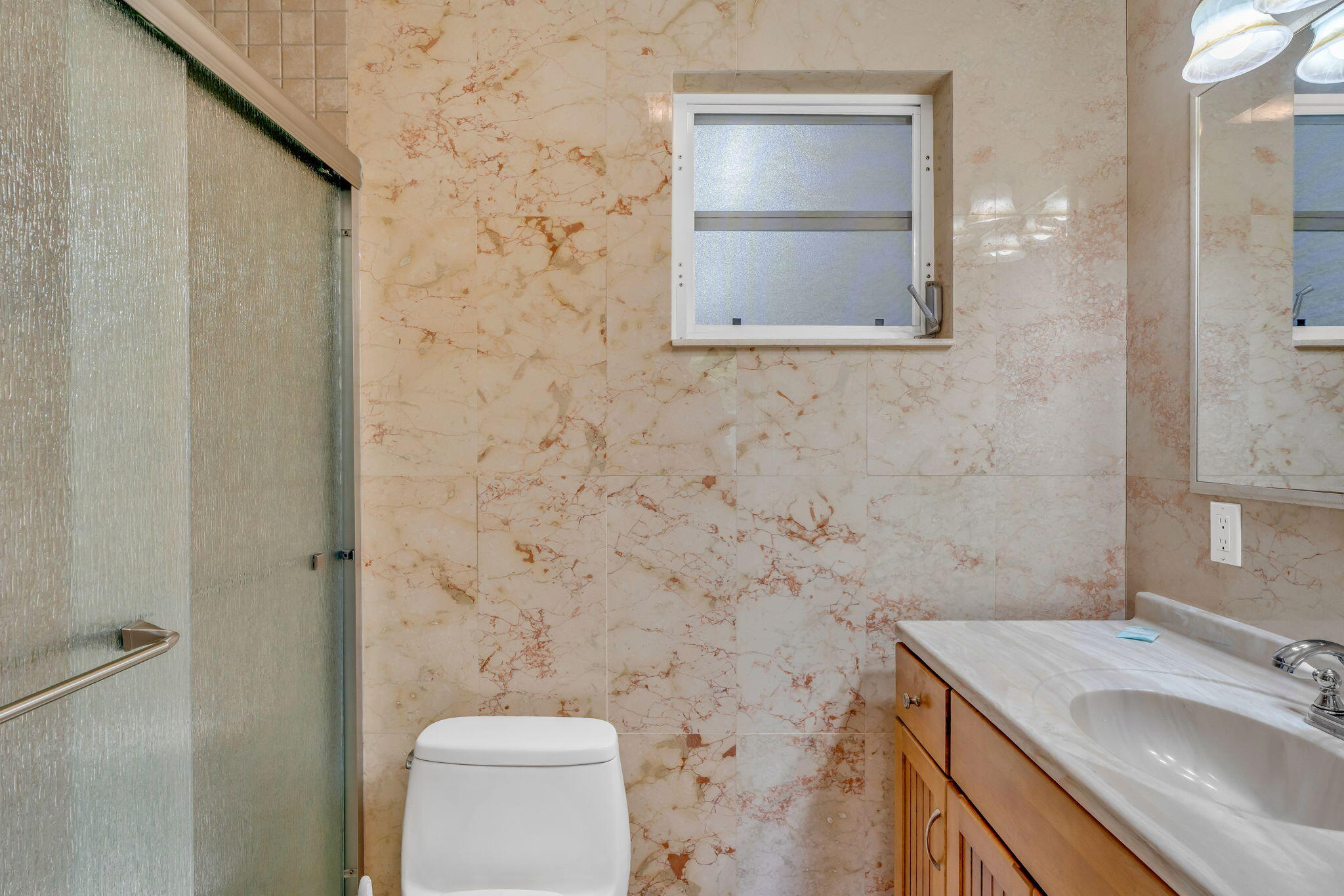 151 Ave G Marathon, FL 33050 - Photo 22 of 56 a bathroom with a granite countertop sink a toilet and a mirror