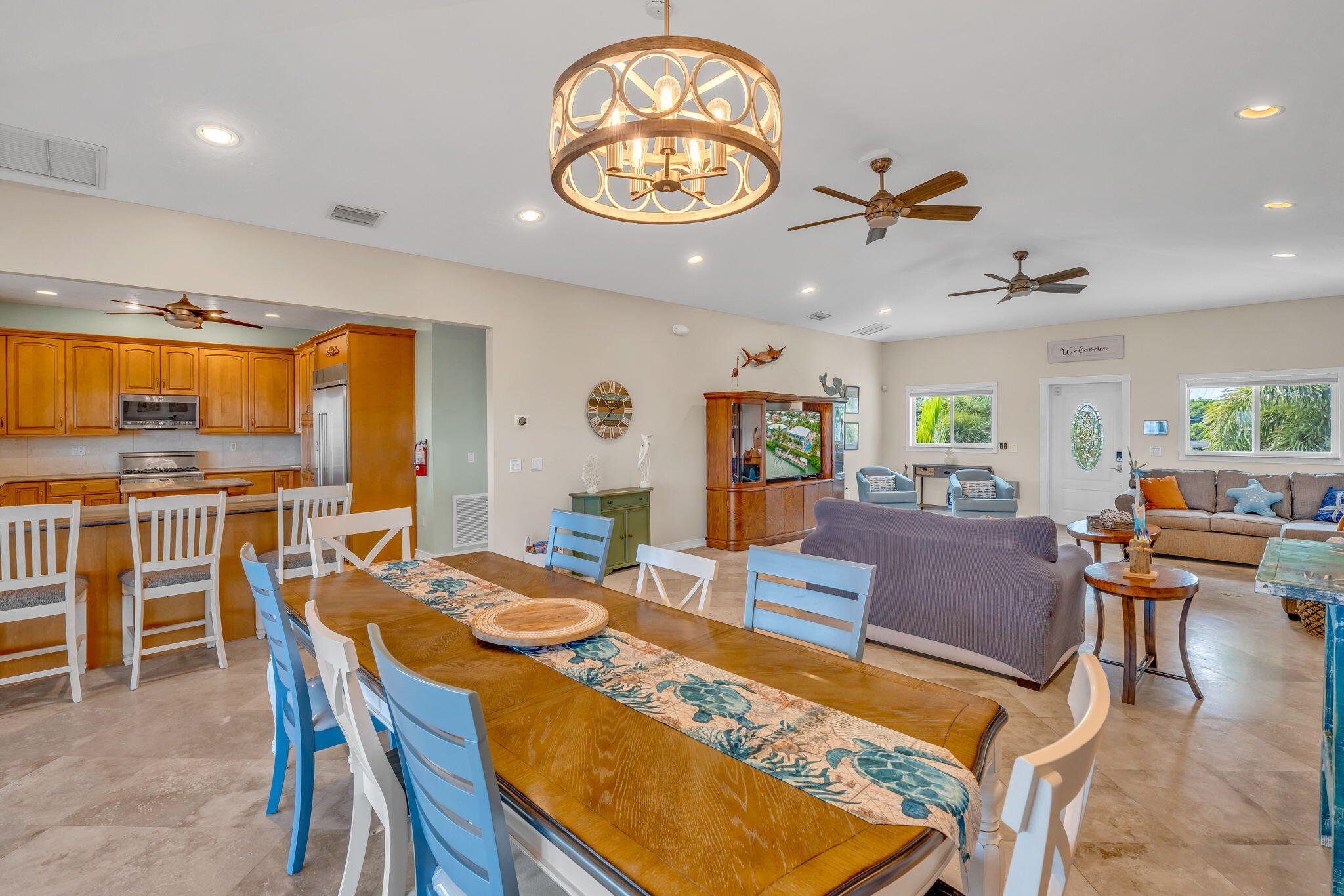 151 Ave G Marathon, FL 33050 - Photo 26 of 56 a view of a dining room with furniture a chandelier and wooden floor