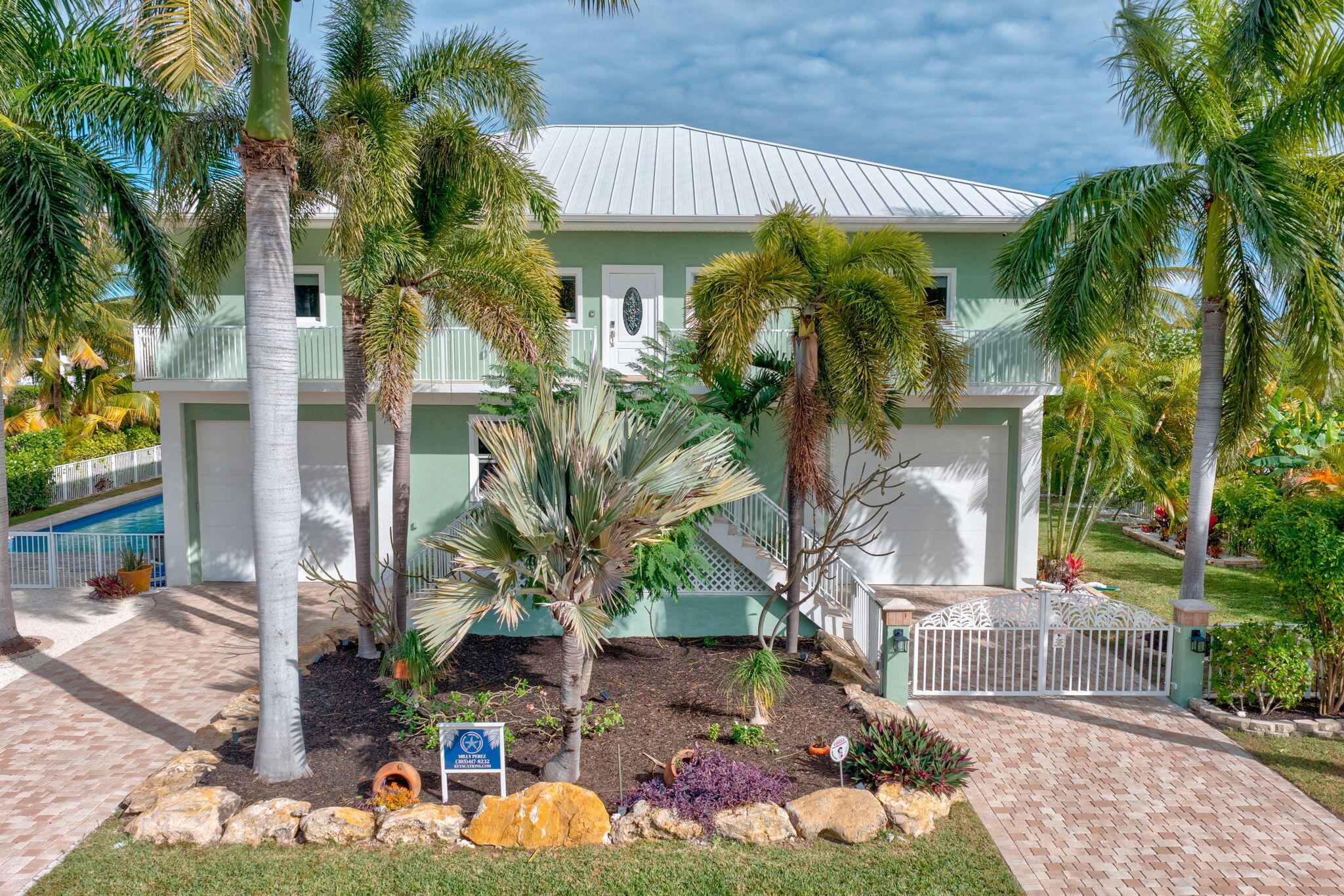 151 Ave G Marathon, FL 33050 - Photo 3 of 56 a front view of a house with a tree