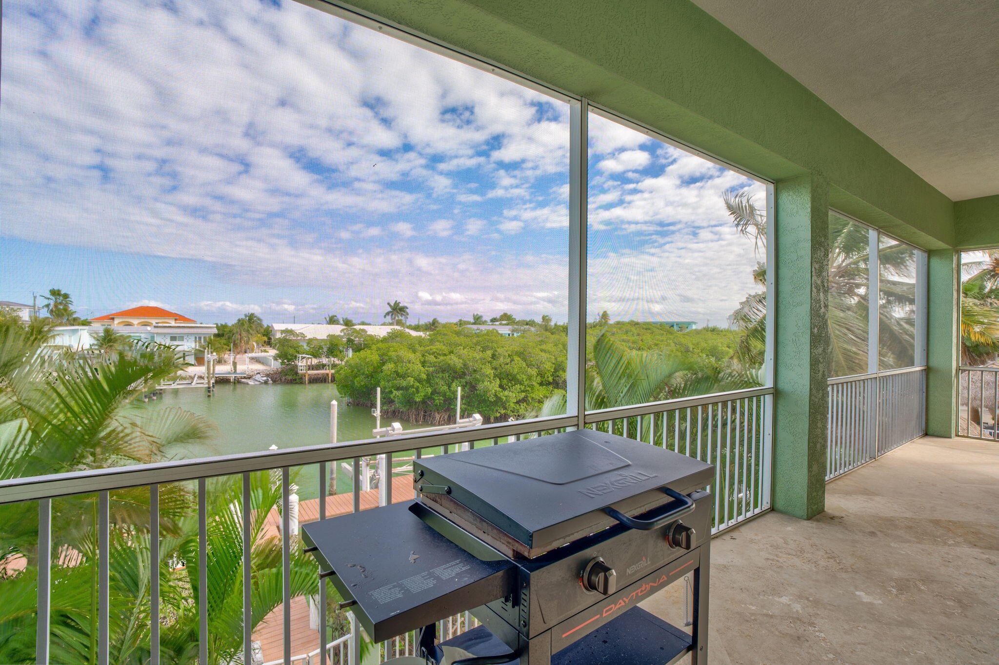 151 Ave G Marathon, FL 33050 - Photo 34 of 56 a view of a balcony with wooden floor and outdoor seating