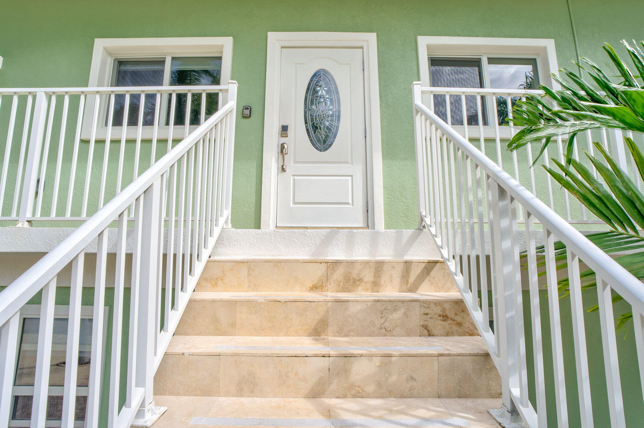 151 Ave G Marathon, FL 33050 - Photo 46 of 56 a view of staircase with lots of frames on wall and a window