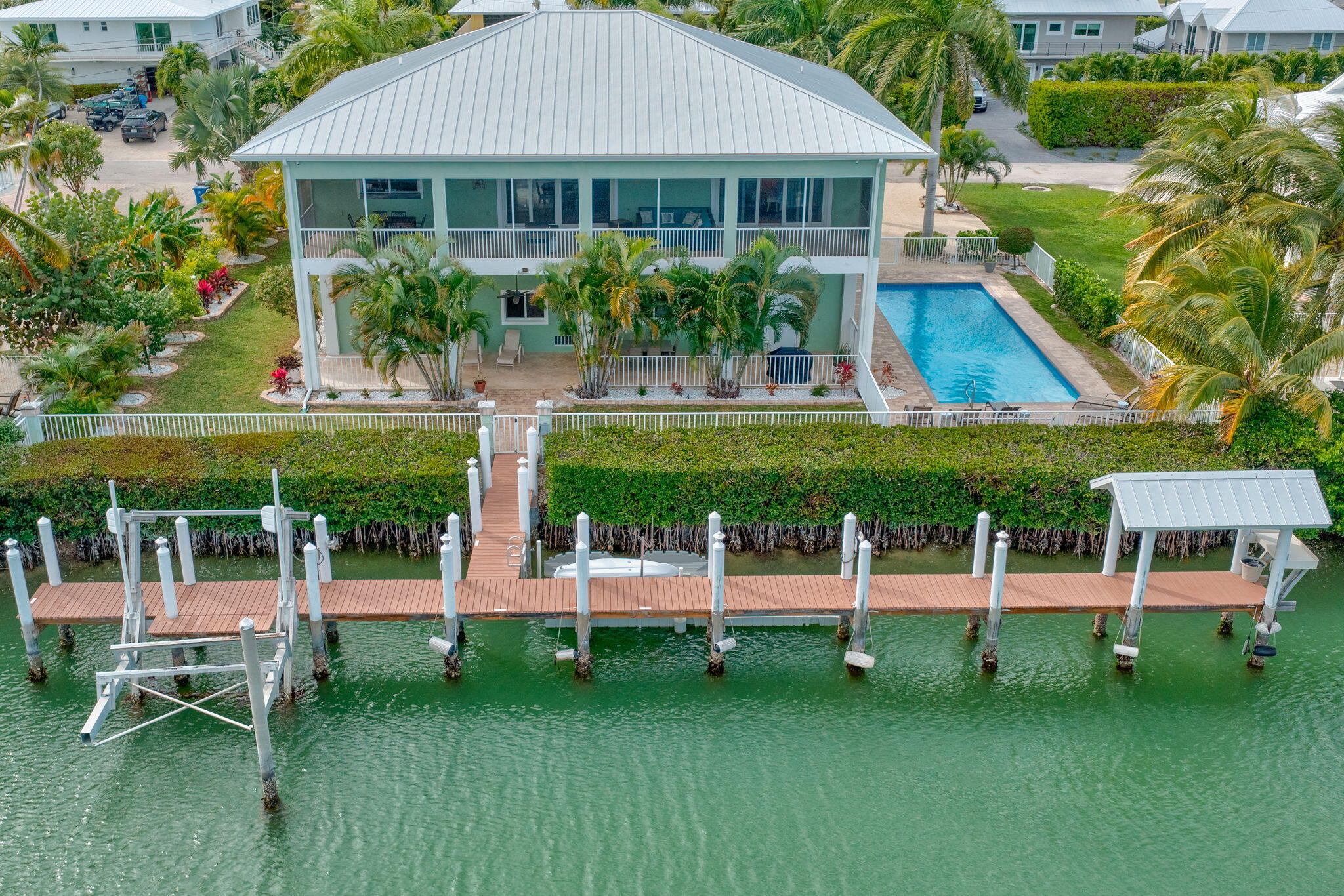 151 Ave G Marathon, FL 33050 - Photo 51 of 56 a view of a house with a yard table and chairs
