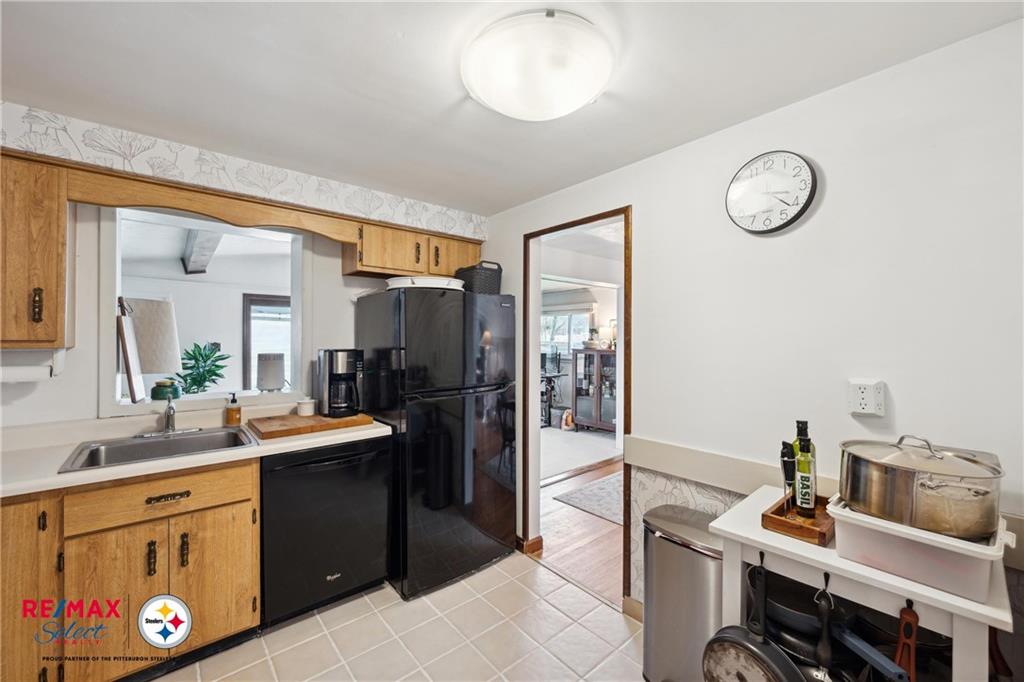 132 Shafer Road Coraopolis, PA 15108 - Photo 13 of 39 a kitchen with stainless steel appliances granite countertop a sink and a refrigerator