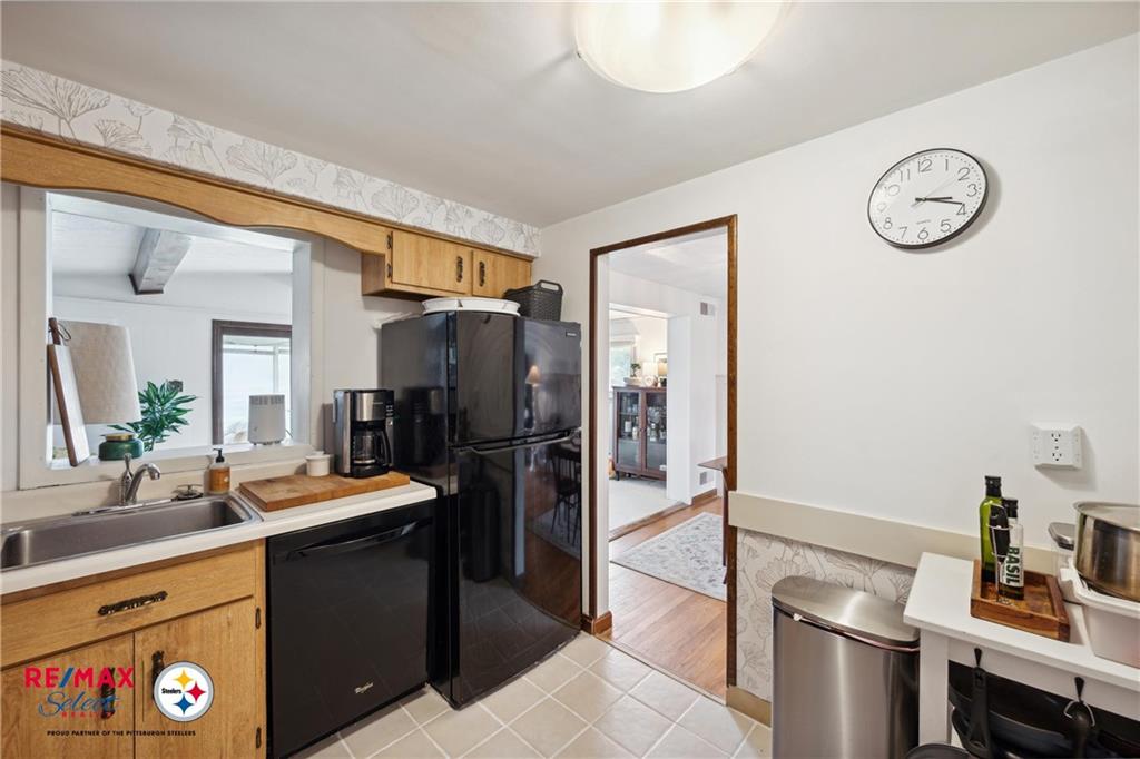 132 Shafer Road Coraopolis, PA 15108 - Photo 14 of 39 a kitchen with a refrigerator and a sink