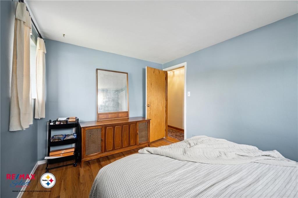 132 Shafer Road Coraopolis, PA 15108 - Photo 18 of 39 a bedroom with a bed and wooden floor