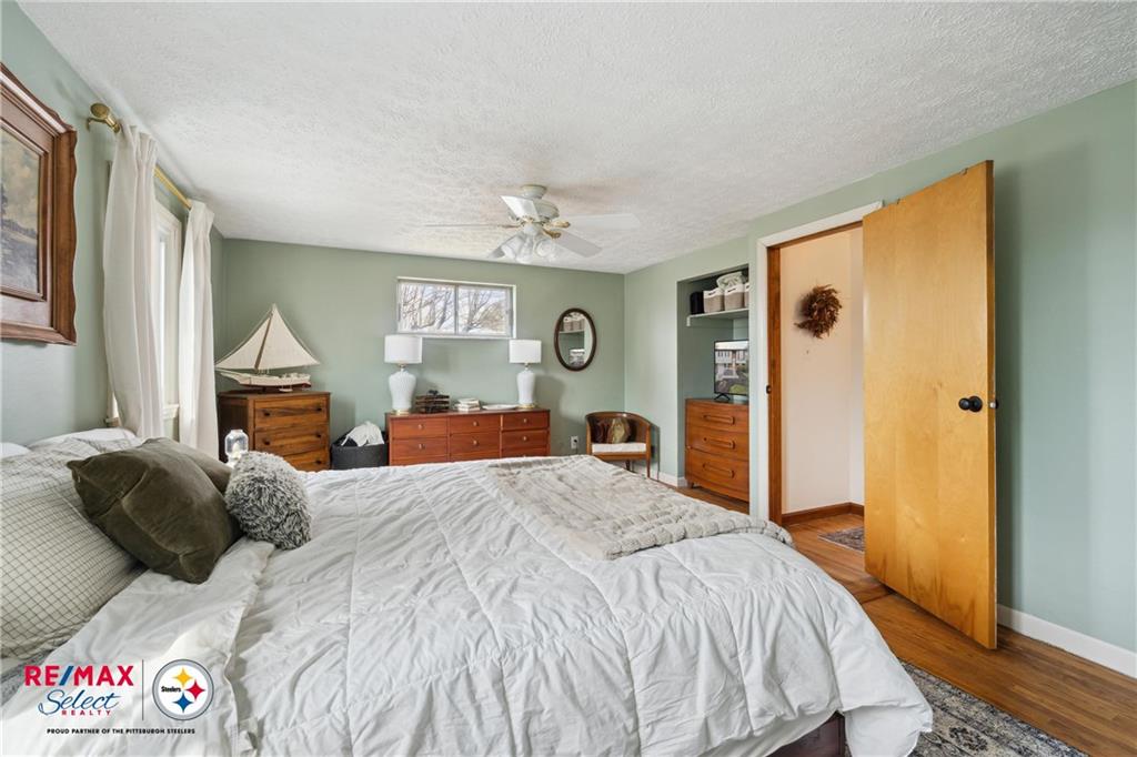 132 Shafer Road Coraopolis, PA 15108 - Photo 22 of 39 a bedroom with a large bed and a chandelier