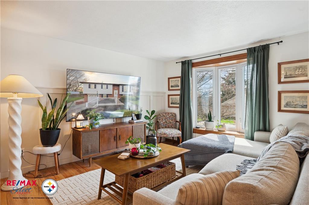 132 Shafer Road Coraopolis, PA 15108 - Photo 9 of 39 a living room with furniture and a large window