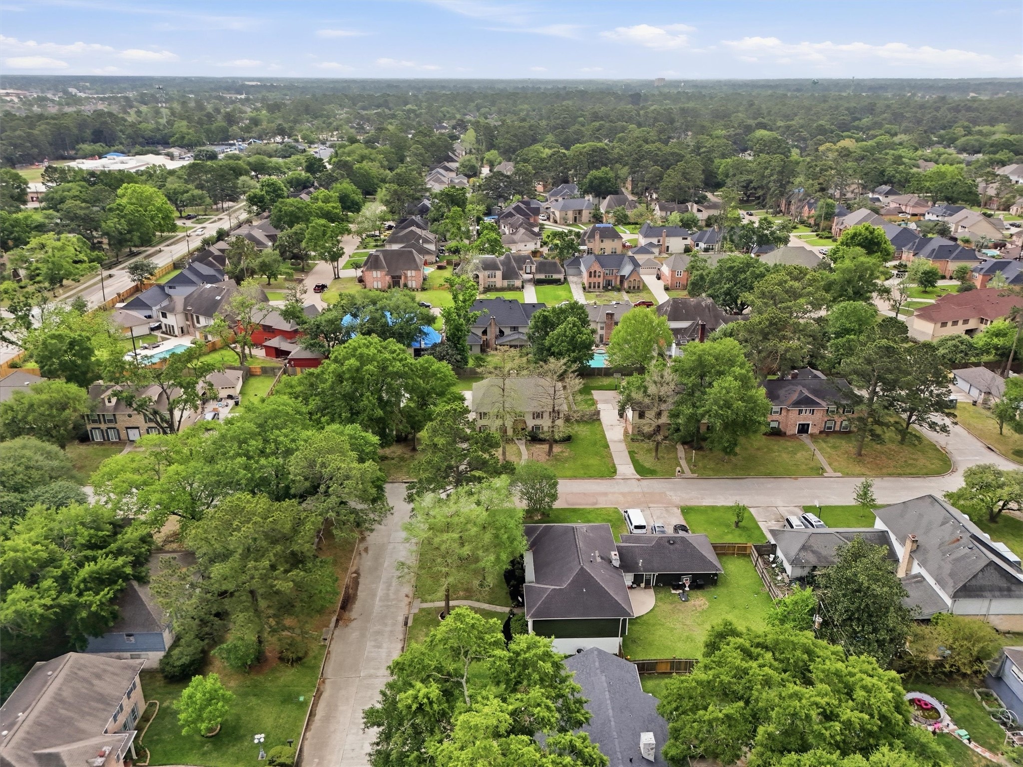 8115 Theisswood Road Spring, TX 77379 - Photo 34 of 36 an aerial view of a houses with outdoor space