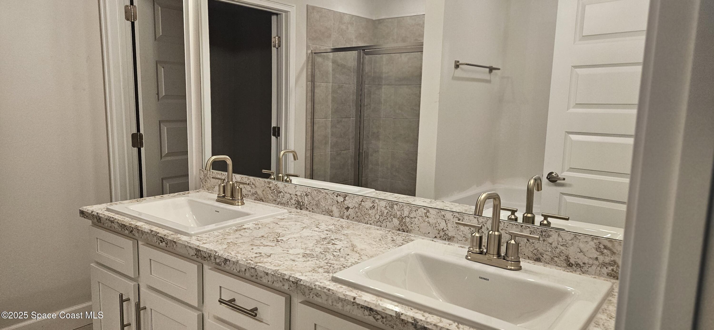 1211 Tupelo Circle Cocoa, FL 32926 - Photo 12 of 15 a bathroom with a sink and a mirror