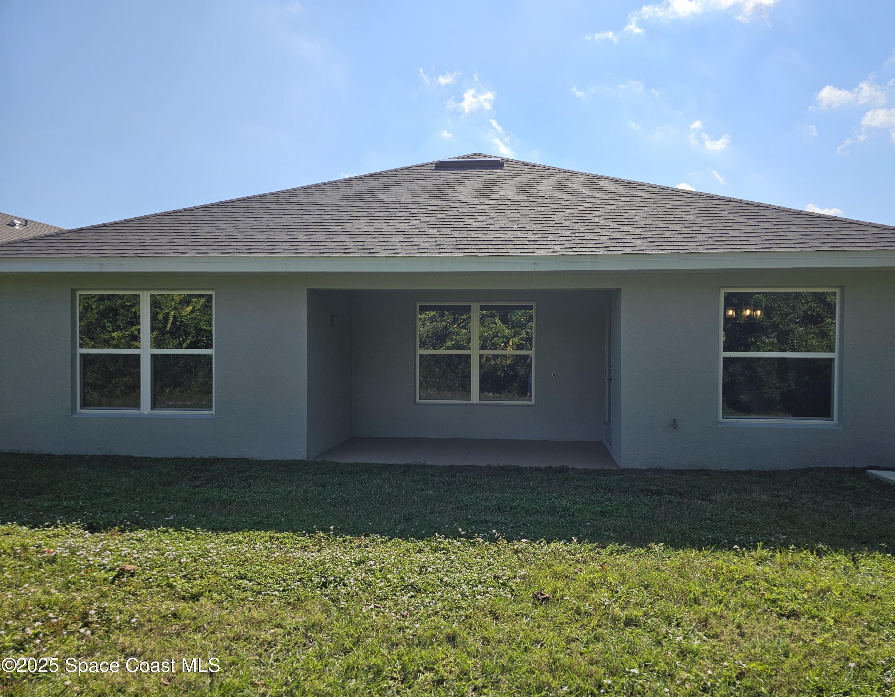 1211 Tupelo Circle Cocoa, FL 32926 - Photo 14 of 15 a house view with a garden space