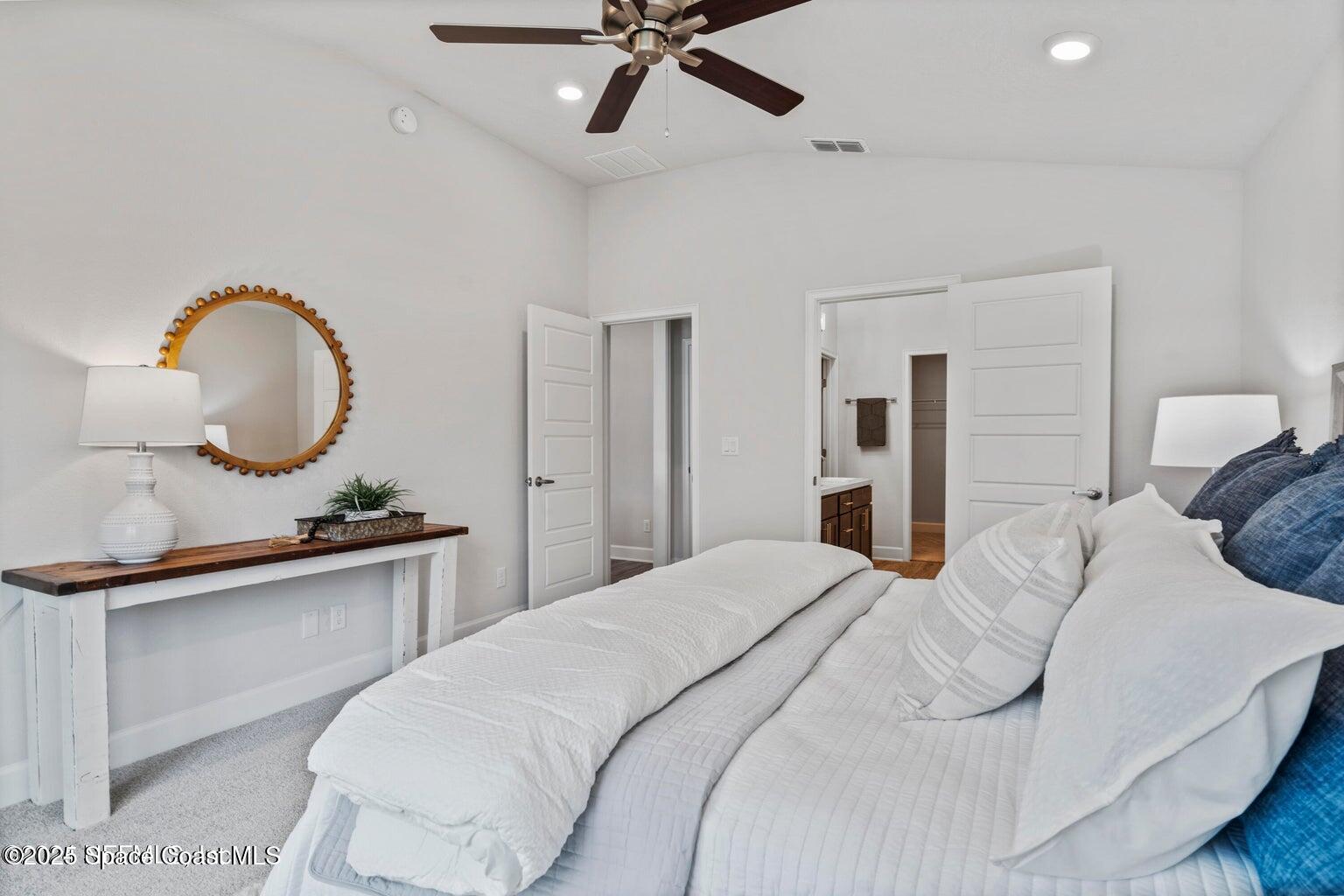 1211 Tupelo Circle Cocoa, FL 32926 - Photo 8 of 15 a bedroom with a bed and a chandelier