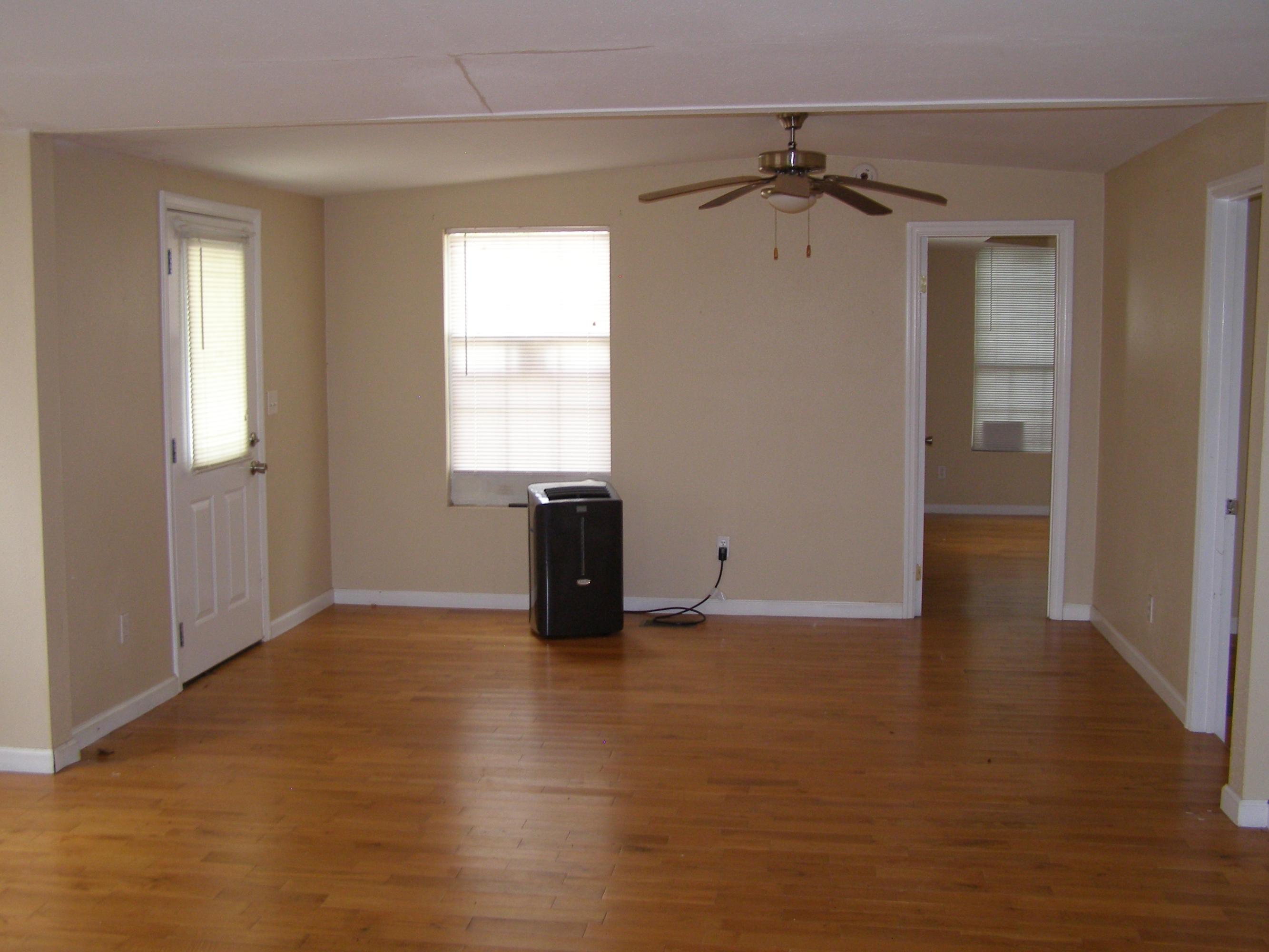 84 Roberts Road East DeFuniak Springs, FL 32433 - Photo 12 of 18 an empty room with wooden floor and a window