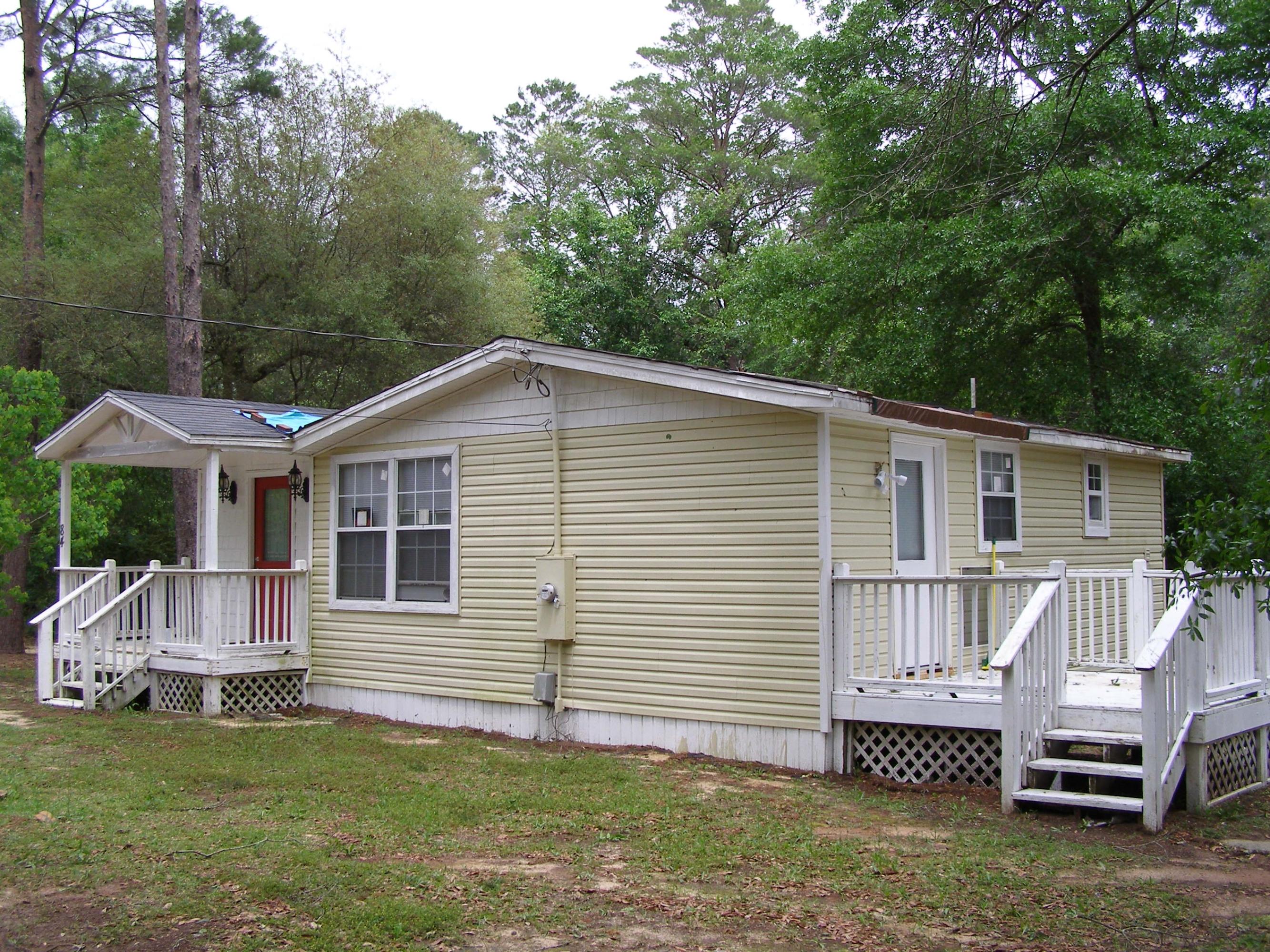 84 Roberts Road East DeFuniak Springs, FL 32433 - Photo 2 of 18 a view of a house with a yard
