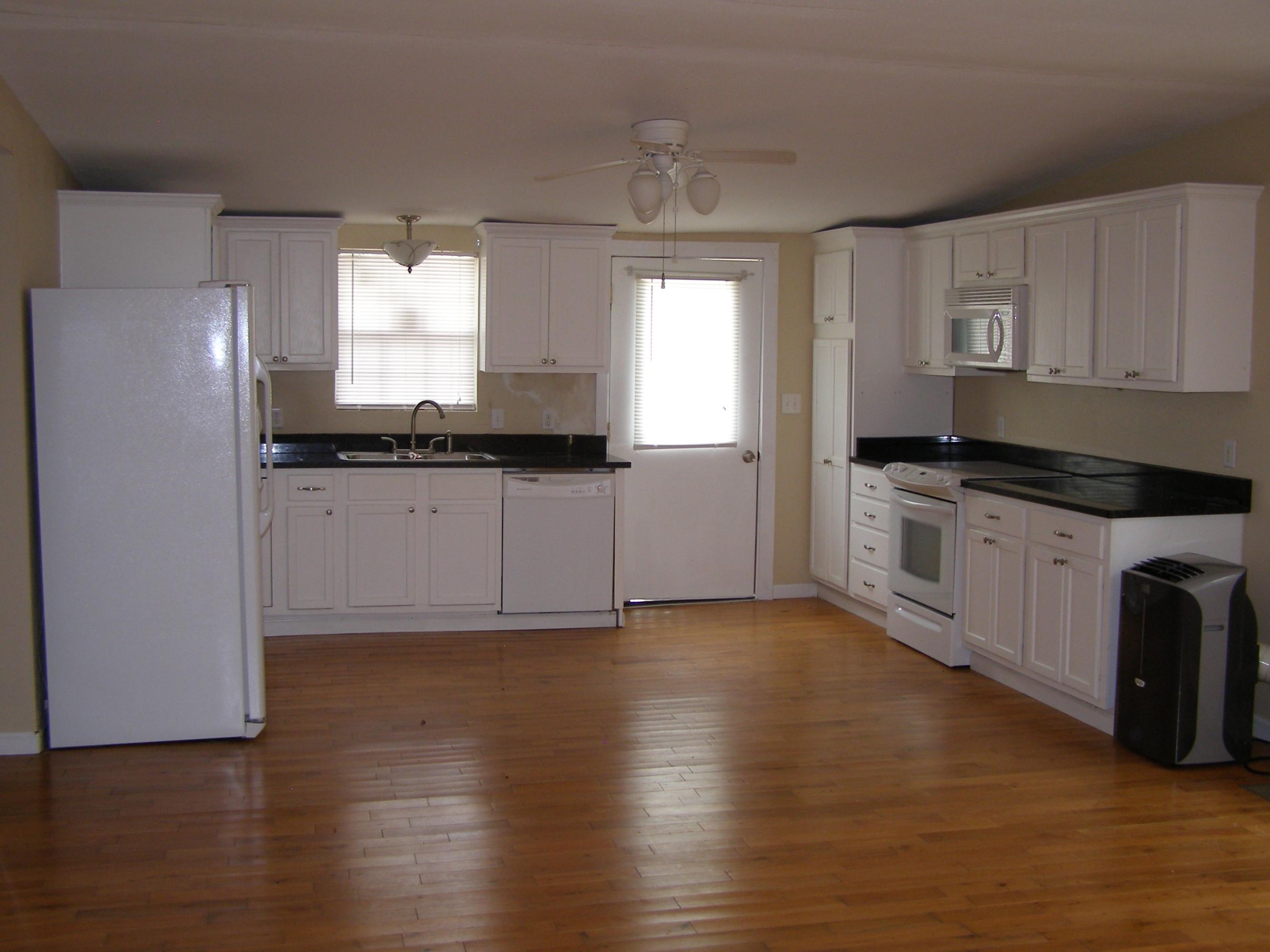 84 Roberts Road East DeFuniak Springs, FL 32433 - Photo 5 of 18 a kitchen with granite countertop a sink cabinets and stainless steel appliances