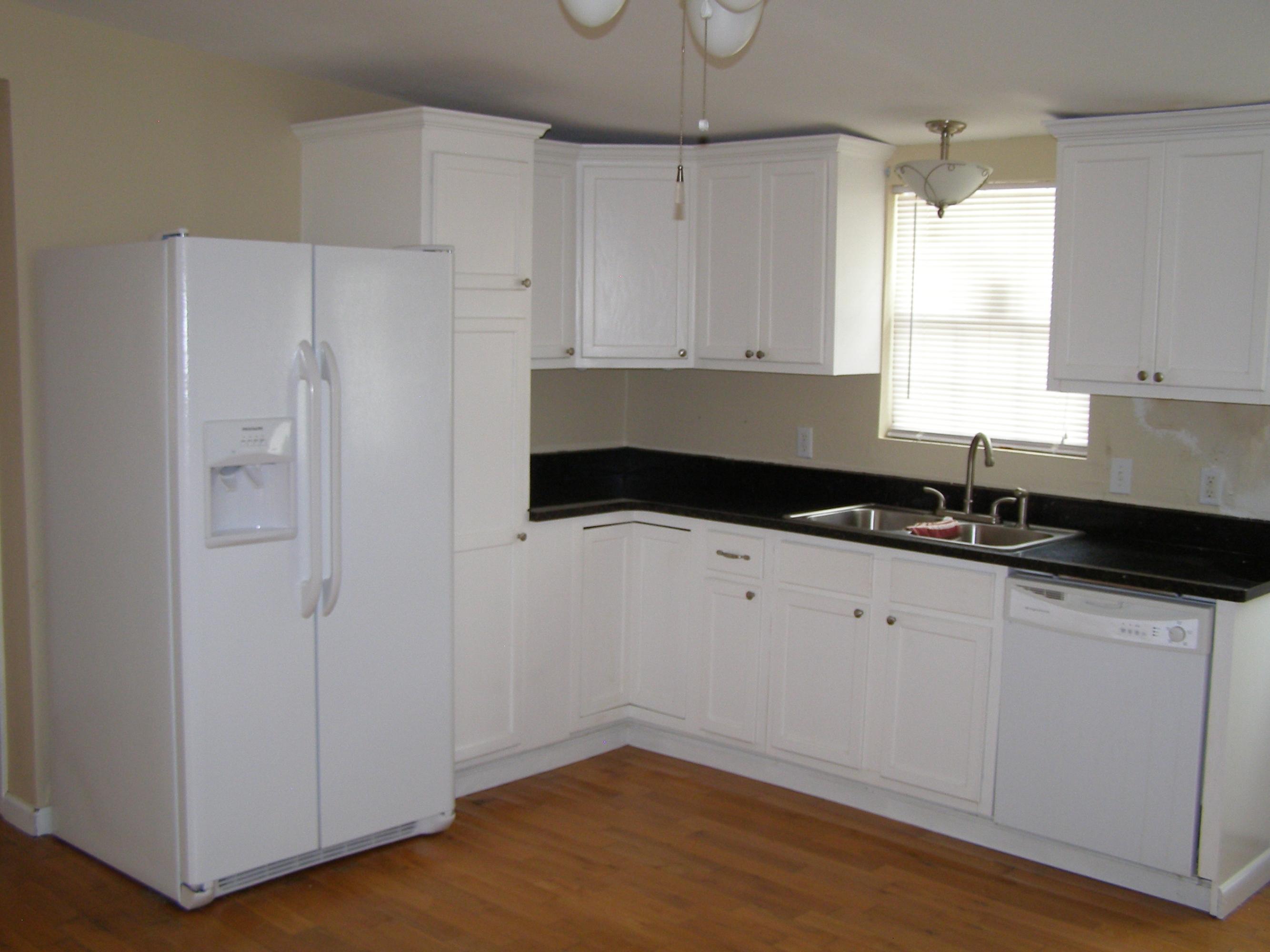 84 Roberts Road East DeFuniak Springs, FL 32433 - Photo 8 of 18 a kitchen with granite countertop white cabinets and sink