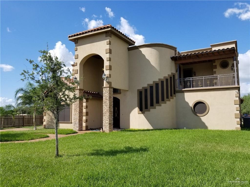 336 Navarro Street Pharr, TX 78577 - Photo 2 of 32 View of front of house with stucco siding, a tile roof, and a balcony