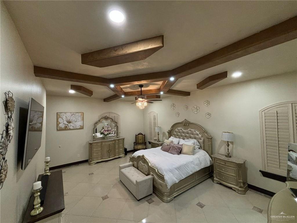 336 Navarro Street Pharr, TX 78577 - Photo 22 of 32 Bedroom with beamed ceiling, recessed lighting, and light tile patterned floors