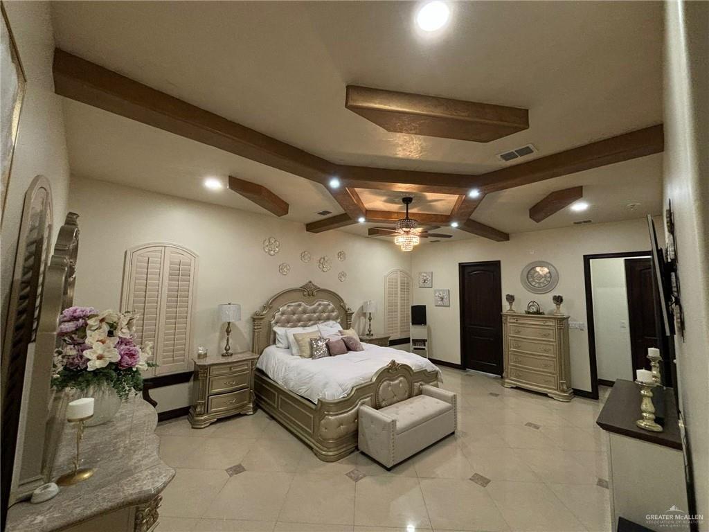 336 Navarro Street Pharr, TX 78577 - Photo 23 of 32 Bedroom featuring beamed ceiling, recessed lighting, and light tile patterned flooring