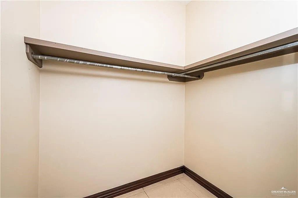 336 Navarro Street Pharr, TX 78577 - Photo 27 of 32 Spacious closet featuring light tile patterned flooring