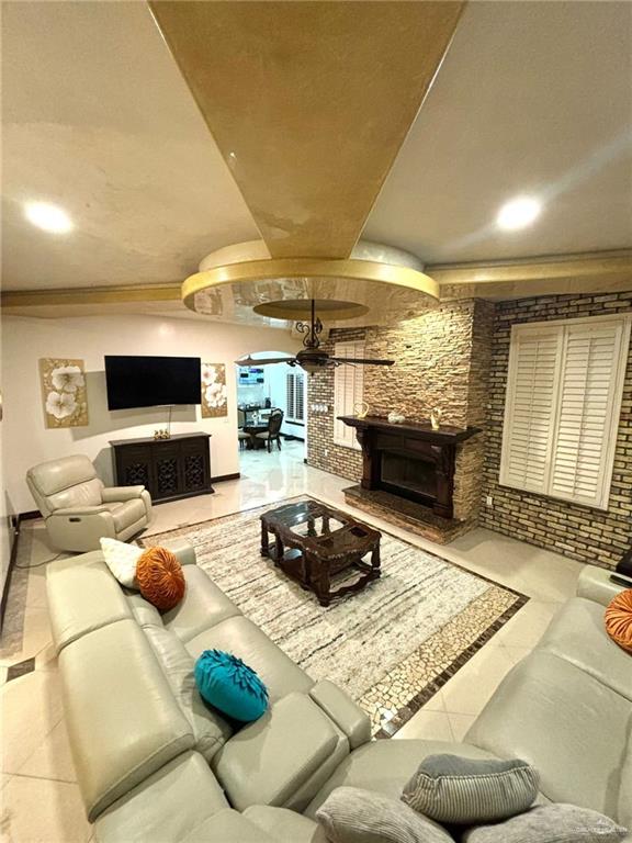 336 Navarro Street Pharr, TX 78577 - Photo 9 of 32 Living area with a fireplace, tile patterned flooring, and recessed lighting
