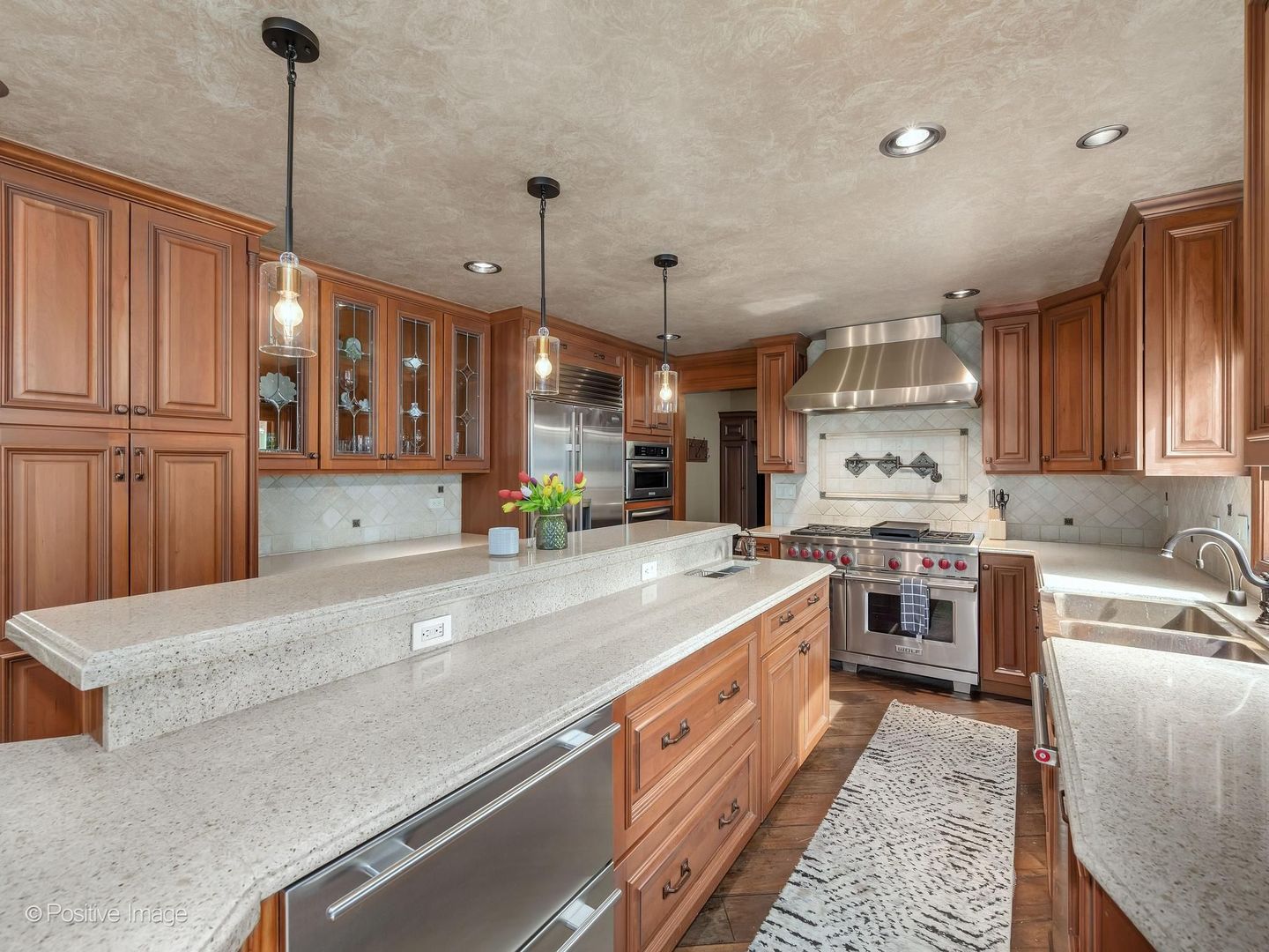 6451 Garfield Ridge Court Burr Ridge, IL 60527 - Photo 10 of 28 a large kitchen with stainless steel appliances granite countertop a sink a stove and a refrigerator