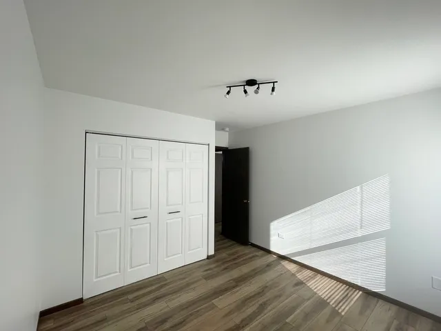 a view of room with hardwood floor