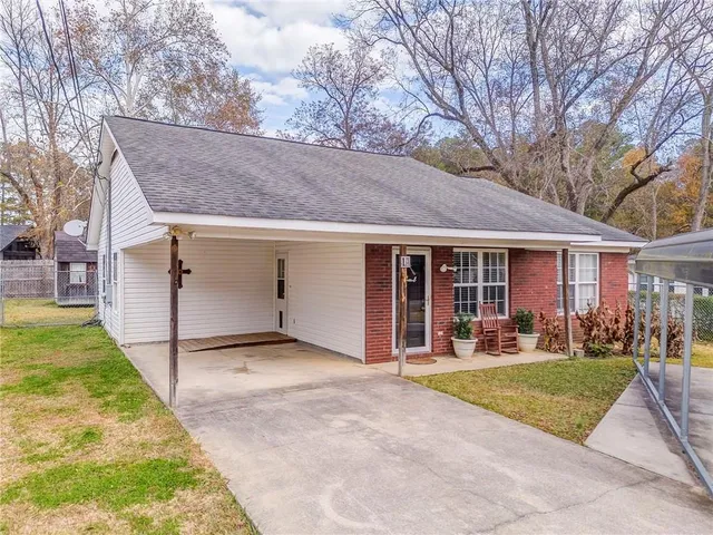 a view of a yard in front view of a house