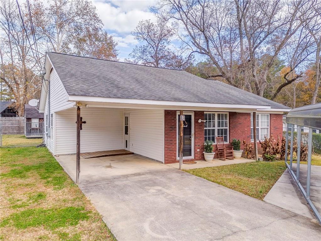 a view of a yard in front view of a house