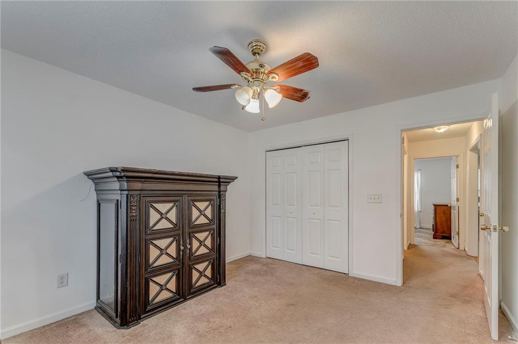 1A Green Acre Road Northeast Rome, GA 30165 - Photo 11 of 29 an empty room with windows and fan