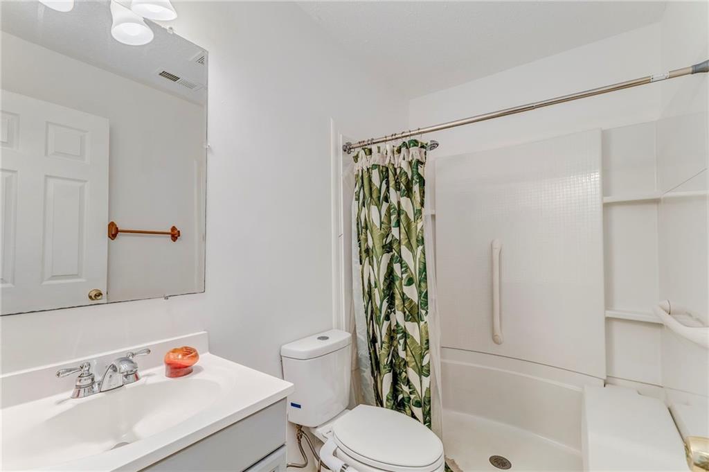 1A Green Acre Road Northeast Rome, GA 30165 - Photo 14 of 29 a bathroom with a sink toilet and shower