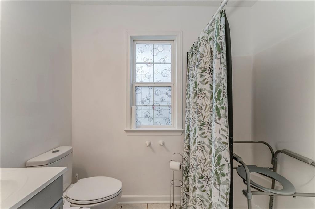 1A Green Acre Road Northeast Rome, GA 30165 - Photo 19 of 29 a bathroom with a toilet a sink and a window
