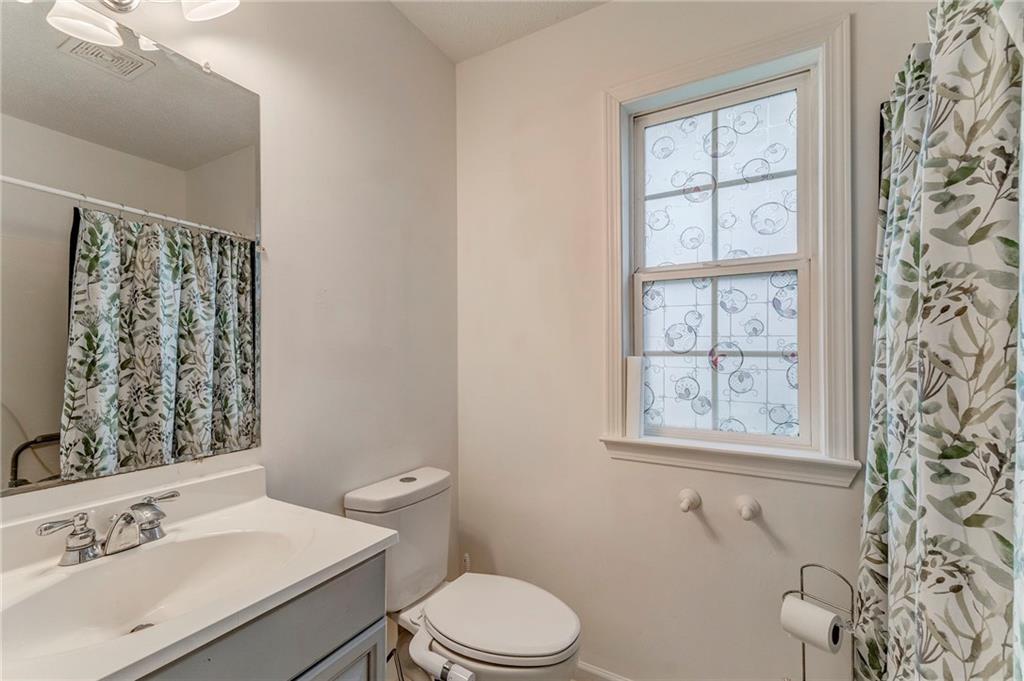 1A Green Acre Road Northeast Rome, GA 30165 - Photo 20 of 29 a bathroom with a sink toilet and window