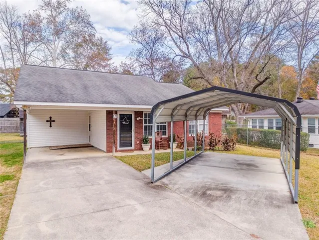 a view of swimming pool with a patio and a yard