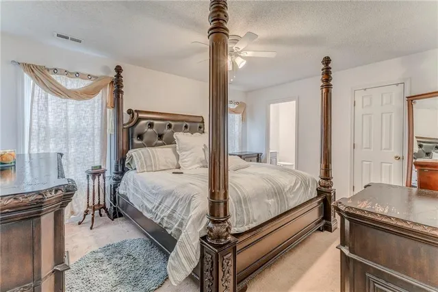 a bed room with a bed and a chandelier