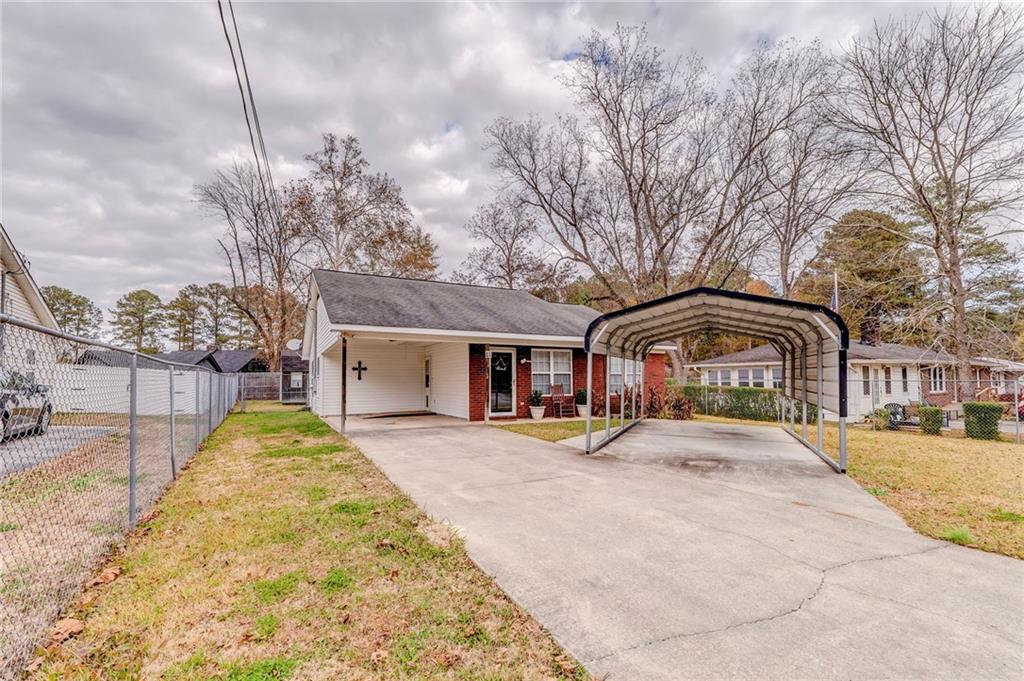 1A Green Acre Road Northeast Rome, GA 30165 - Photo 27 of 29 a front view of house with yard covered in snow
