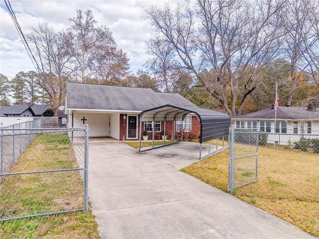 a view of a house with swimming pool