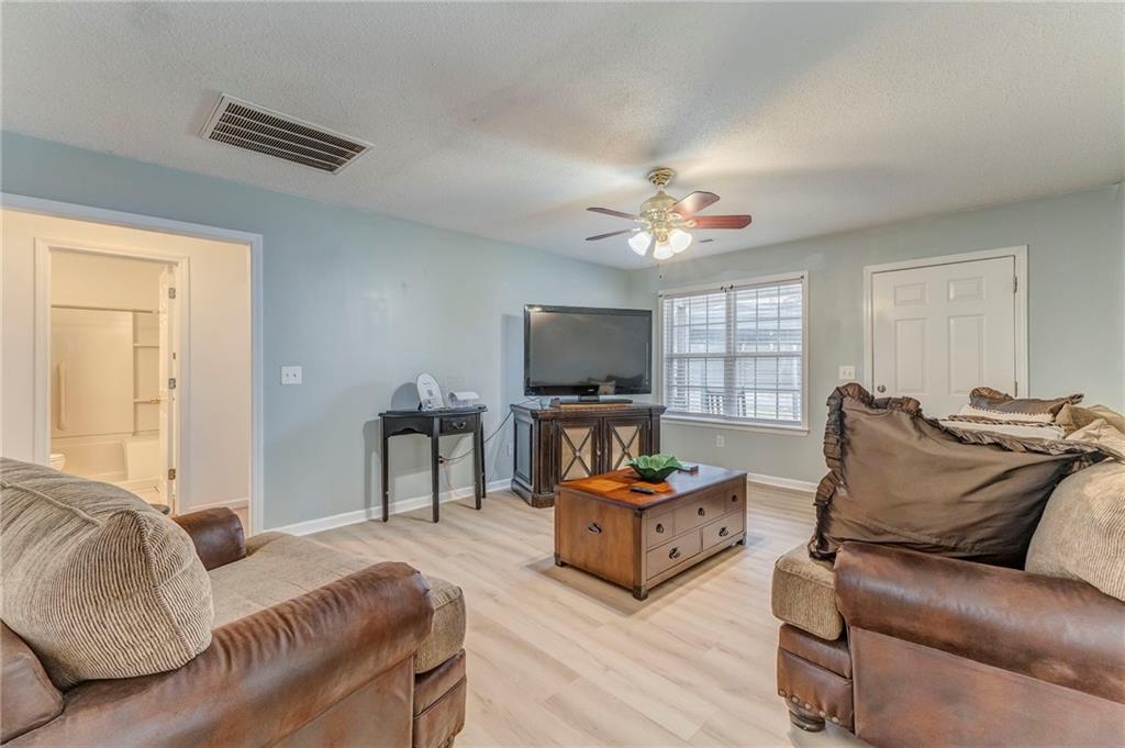 1A Green Acre Road Northeast Rome, GA 30165 - Photo 5 of 29 a living room with furniture and a flat screen tv