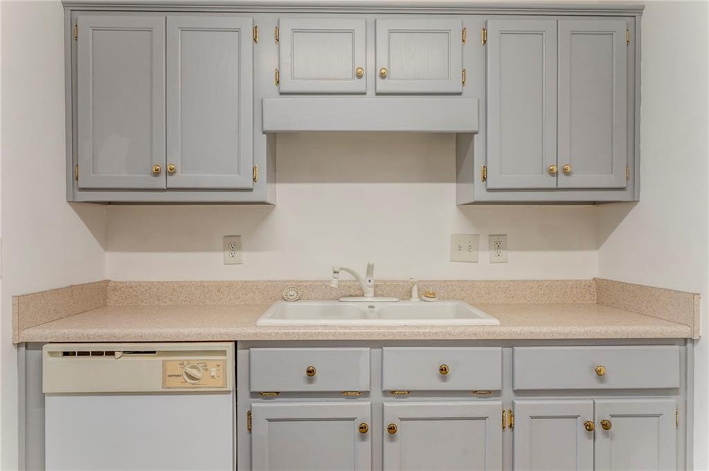 1A Green Acre Road Northeast Rome, GA 30165 - Photo 9 of 29 a view with cabinets a sink and dishwasher in it