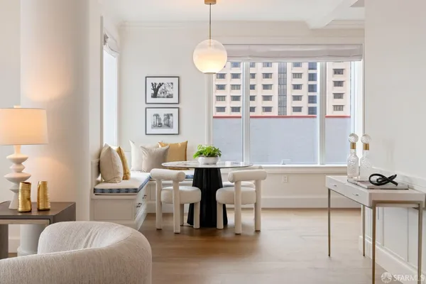 a kitchen with a table and chairs in it