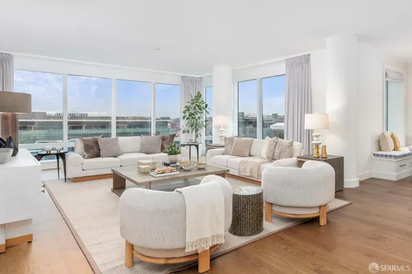 a living room with furniture and a lamp