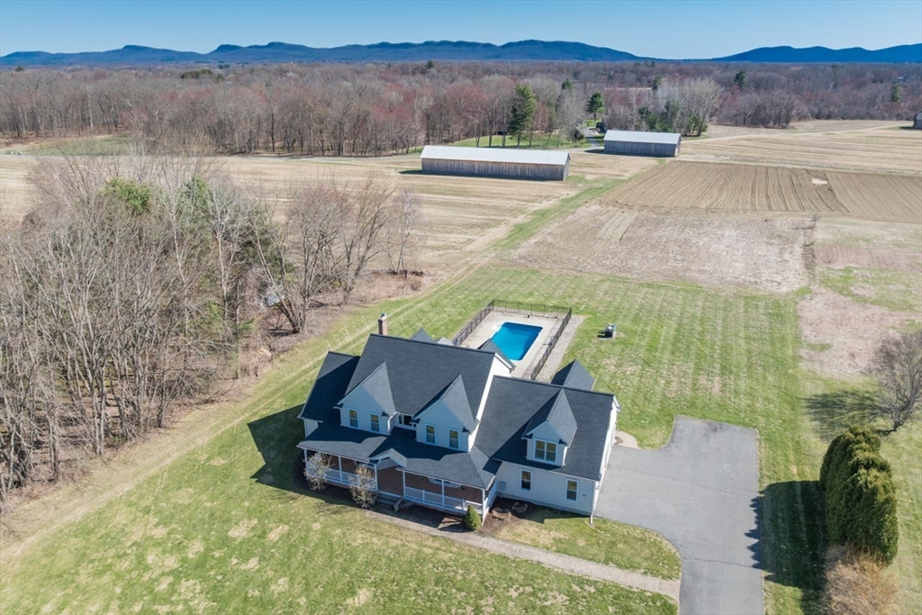 a view of a lake with a yard and mountain view