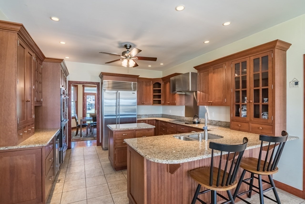 65 Bridge Street Hatfield, MA 01038 - Photo 12 of 40 a kitchen with stainless steel appliances granite countertop a sink and a refrigerator