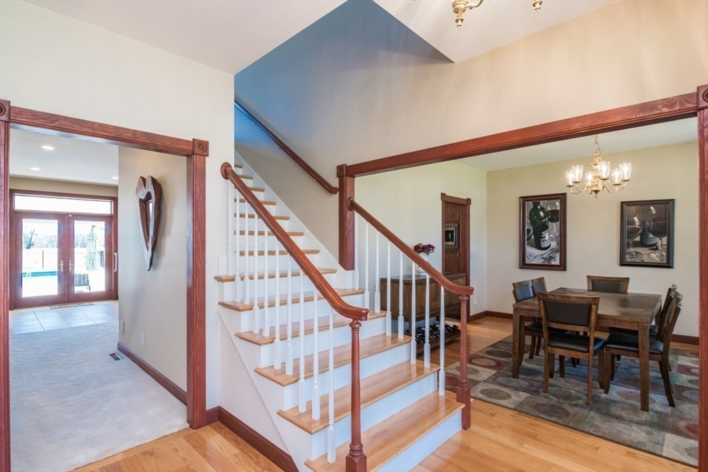 65 Bridge Street Hatfield, MA 01038 - Photo 21 of 40 a view of entryway dining room and hall with wooden floor
