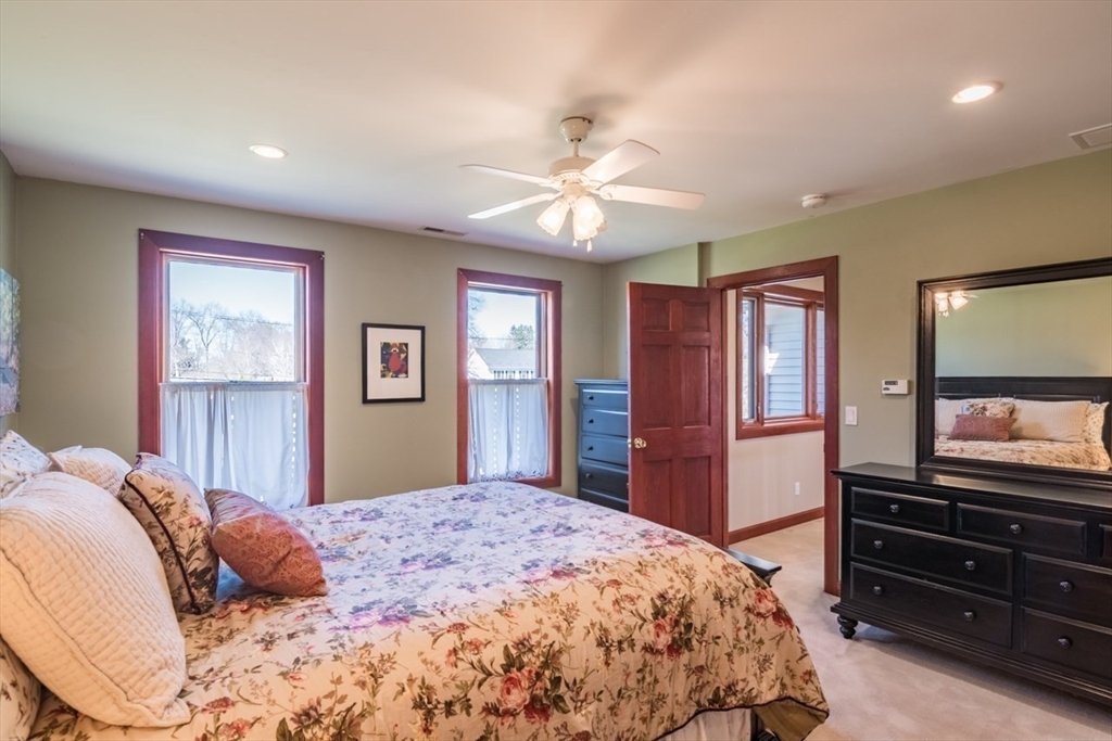 65 Bridge Street Hatfield, MA 01038 - Photo 24 of 40 a bedroom with a bed and a flat screen tv