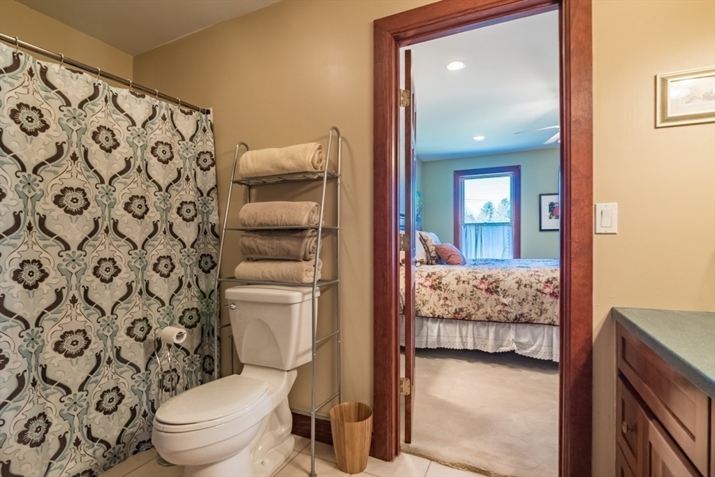 65 Bridge Street Hatfield, MA 01038 - Photo 25 of 40 a en suite bathroom with a toilet sink and a mirror