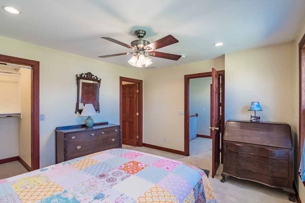 65 Bridge Street Hatfield, MA 01038 - Photo 27 of 40 a bedroom with a bed and a dresser