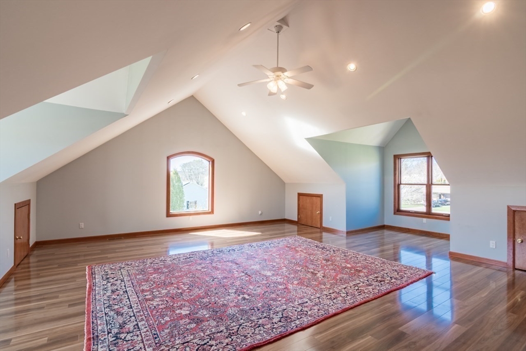 65 Bridge Street Hatfield, MA 01038 - Photo 29 of 40 a view of an empty room with window and wooden floor