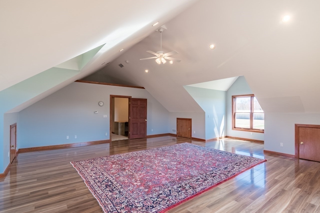 65 Bridge Street Hatfield, MA 01038 - Photo 30 of 40 a view of a hallway with wooden floor and a rug