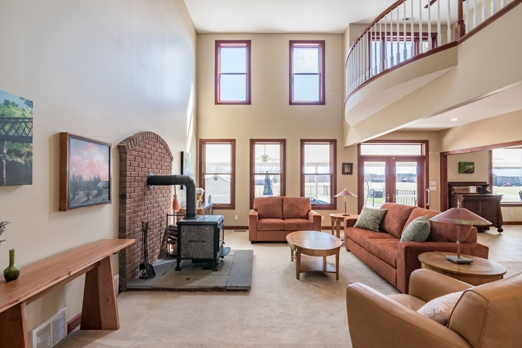 65 Bridge Street Hatfield, MA 01038 - Photo 5 of 40 a living room with furniture and a large window